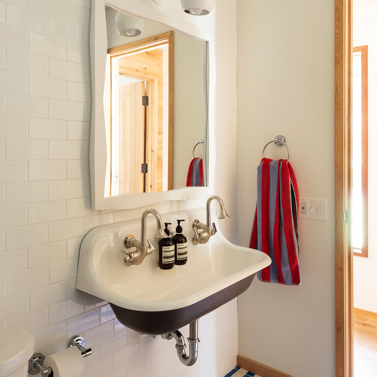 Zoomed out picture of Modern white oak finished medicine cabinet in a bathroom