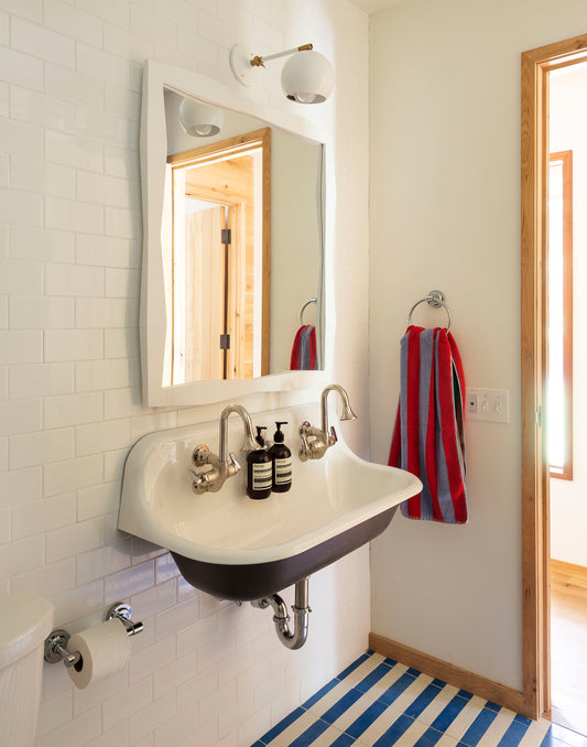 Zoomed out picture of Modern white oak finished medicine cabinet in a bathroom