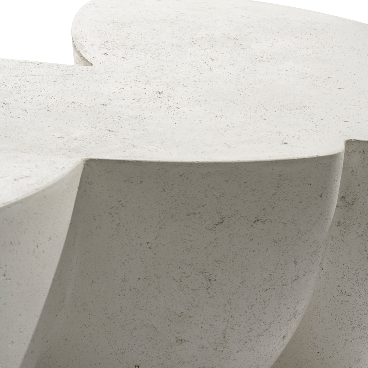  Close-up of a white concrete stool with a smooth surface.
