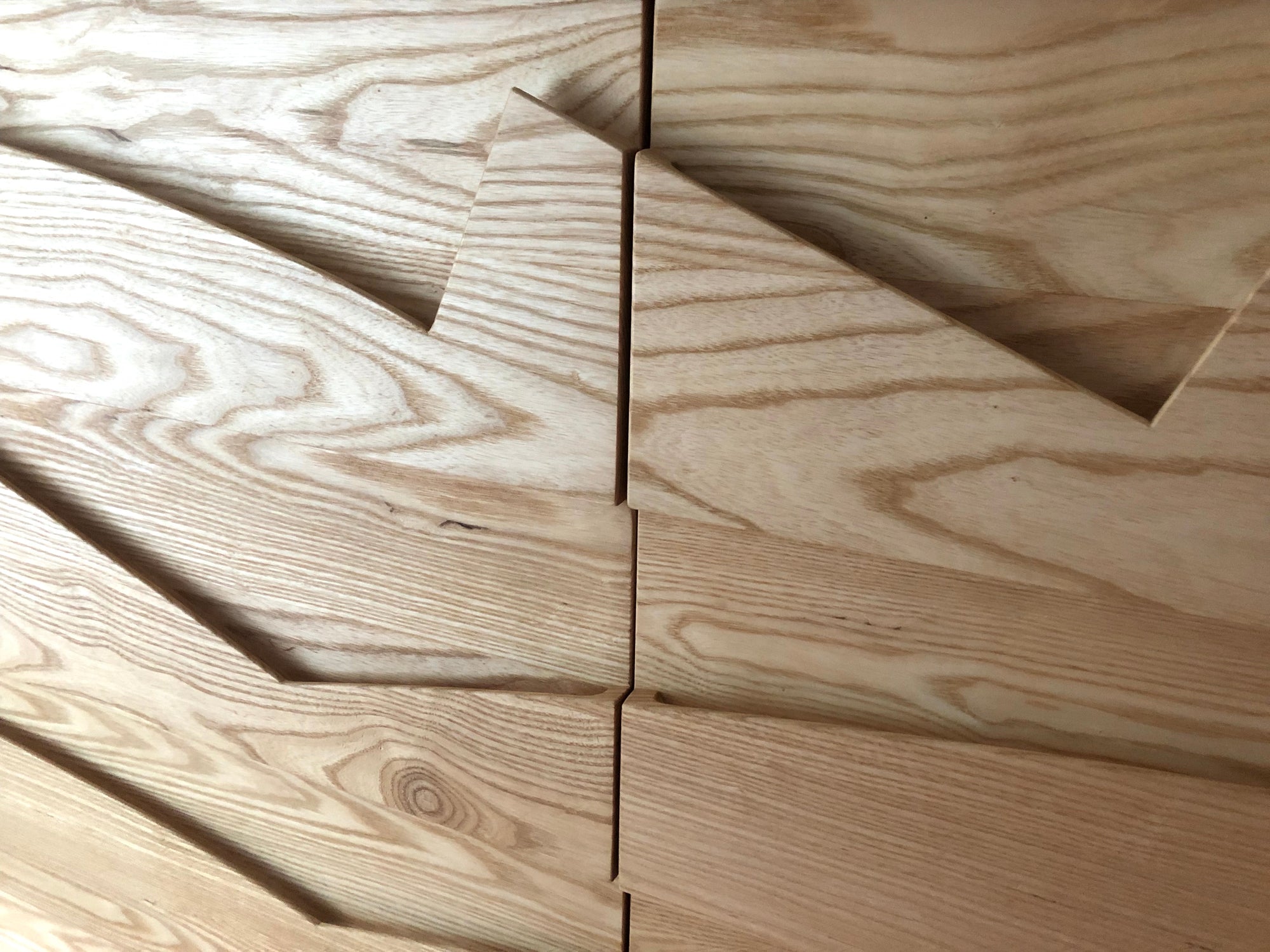 Close up of modern Carved Pull Dresser with a white oak finish 